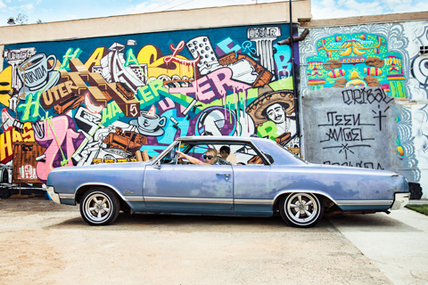 Lady in lowrider with child San Diego California