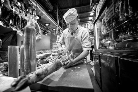 Butcher slicing carcuterie Madrid Spain